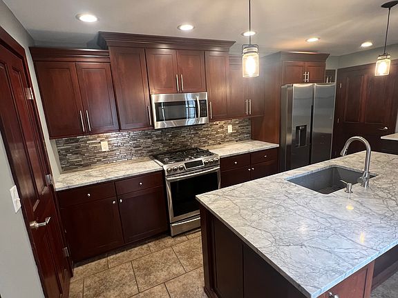 Beautiful cherry kitchen with extra large Granite island with seating. Great for entertaining.