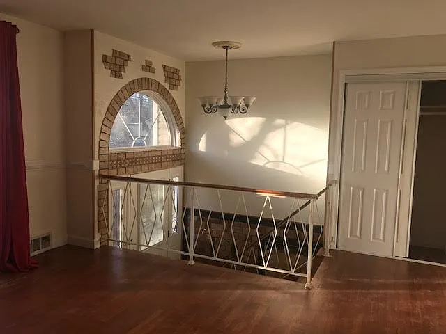 Entry door shows split levels. Your suite is on the main floor. Living room to the right as you go up the steps.
