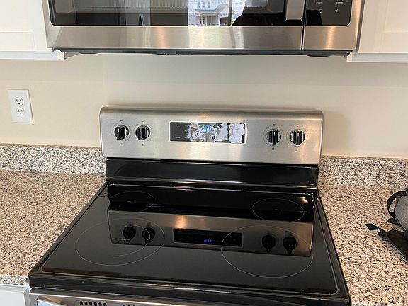brand new microwave and gas stove