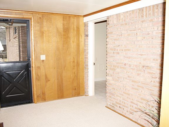 Den with backyard access.