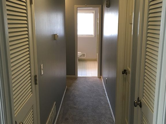 Main hallway with 2 closets