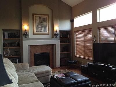 Two Story Family  Room w/ Gas Fireplace, Built Ins, Wall of Wind