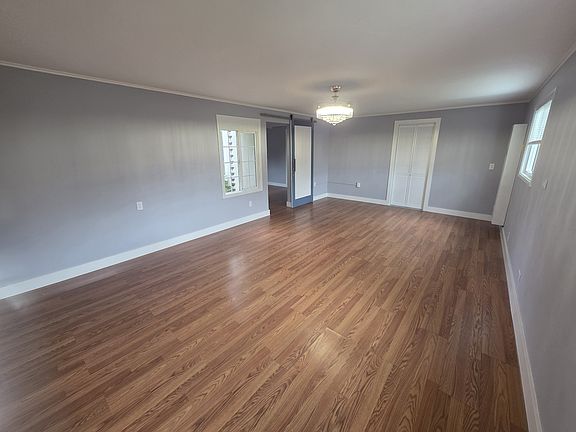 Living / Dining area with barn door to the bedroom