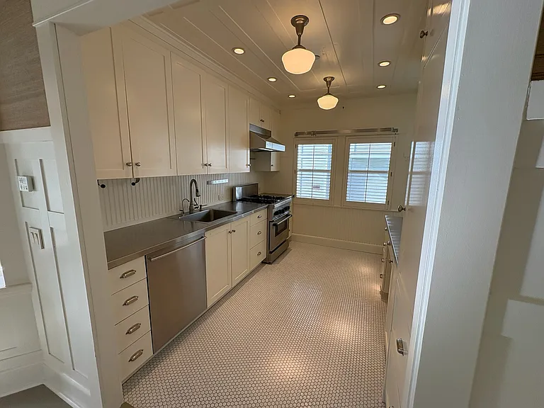 Modern kitchen with restoration hardware fixtures