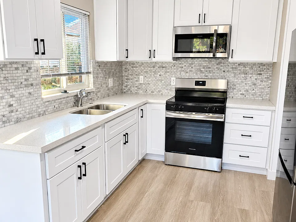 Kitchen with granite counter tops tile back splash all new cabinets