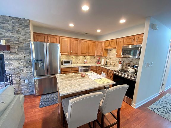 Kitchen with granite countertops, stainless steel appliances
