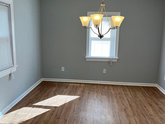 The dining room is open to the living room and kitchen.