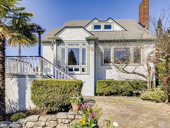 High off the street, this home feels like a villa hideaway.