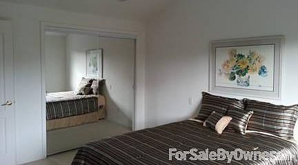 Bedroom : Rm 11'6"x13'10". Bed centered under 11 ft cathedral ceiling. Wndw on wall to R.