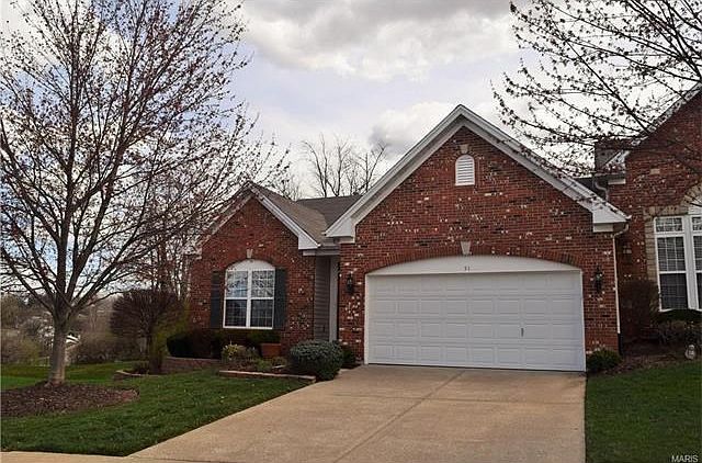 Full brick front, this villa sits on .36 acre. 2 car garage in a GATED community.