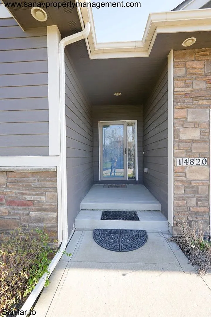 "Luxury Ranch Living: Your Dream Home with Furnished Basement in Urbandale" — Photo 4