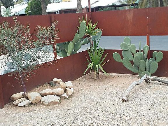 front yard with metal fence