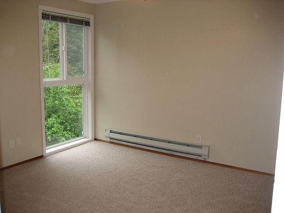 One of 2 roomy bedrooms with full closets