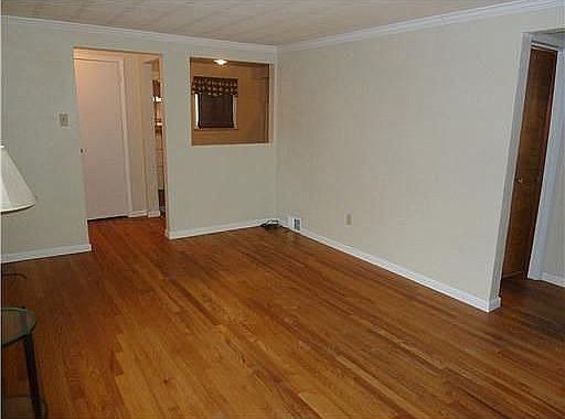 Beautiful hardwood floors enhance this space.