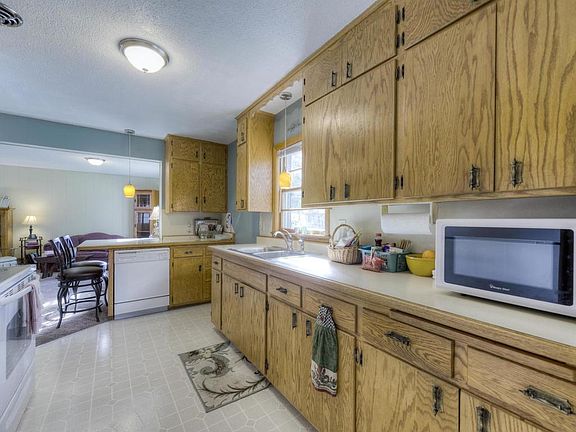 Spacious kitchen with window over the sink looking out to the front.