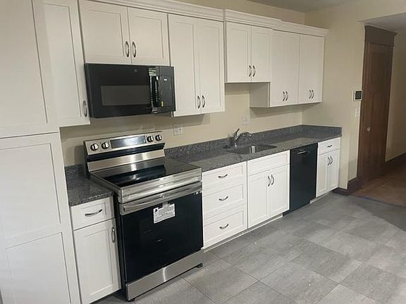 Brand new appliances include stove, fridge, microwave and dishwasher Granite countertop