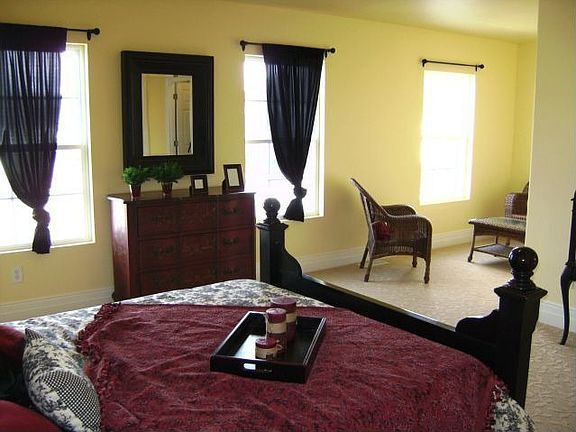 Master bedroom sitting area that overlooks park