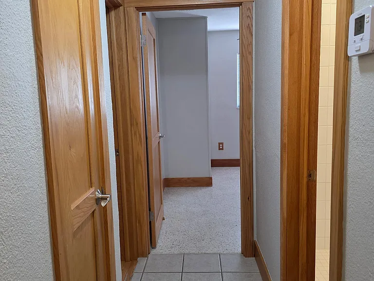 Hallway to closet, bedrooms and bathroom