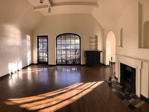 Spacious living room, vaulted beamed ceiling, southern exposure and views with private balcony.