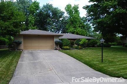 Exterior Front 2
						:
						2 car garage, concrete driveway with street lamp