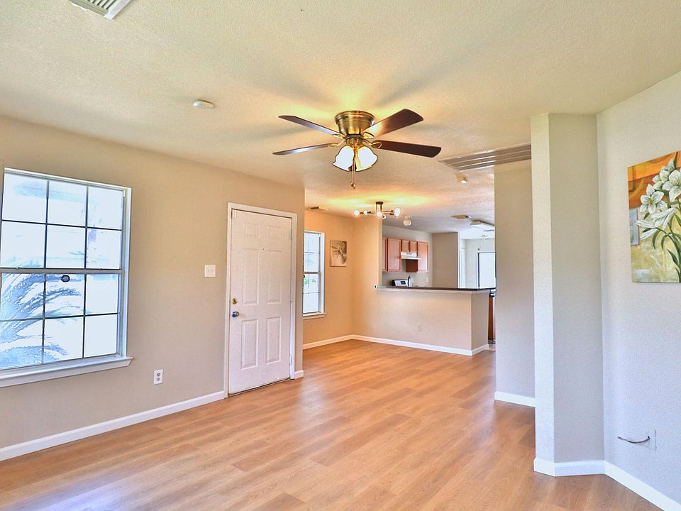 Open floor plan, lots of nature light , new floor and paint