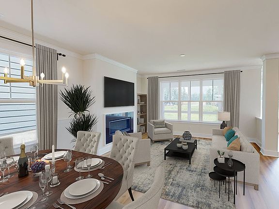 The dining room and great room of the Sinclair by Brookfield Residential