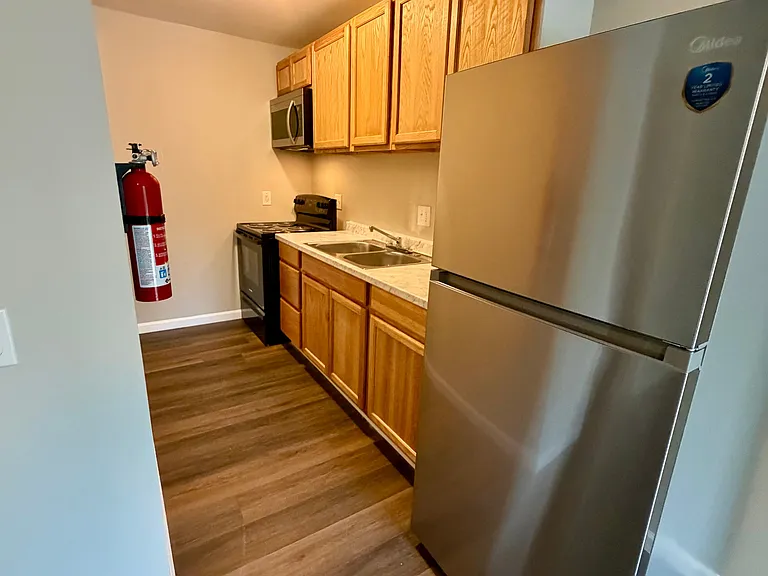 Galley style kitchen with stainless steel appliances