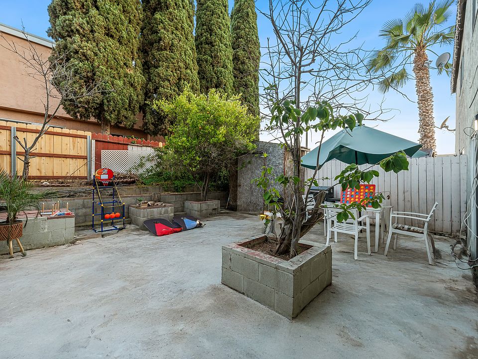 Spacious, gated backyard offering privacy and plenty of room for outdoor fun.