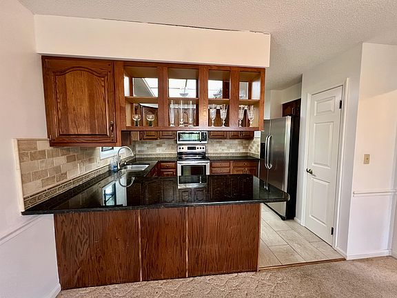 Updated Kitchen with Tile and Granite Countertops