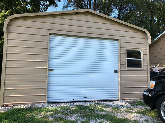 Large metal detached garage plus off street parking. Large enough for shop.