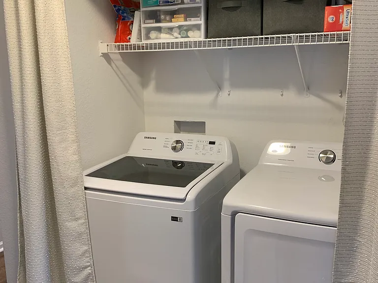 Laundry closet in hallway. Washer and dryer included.