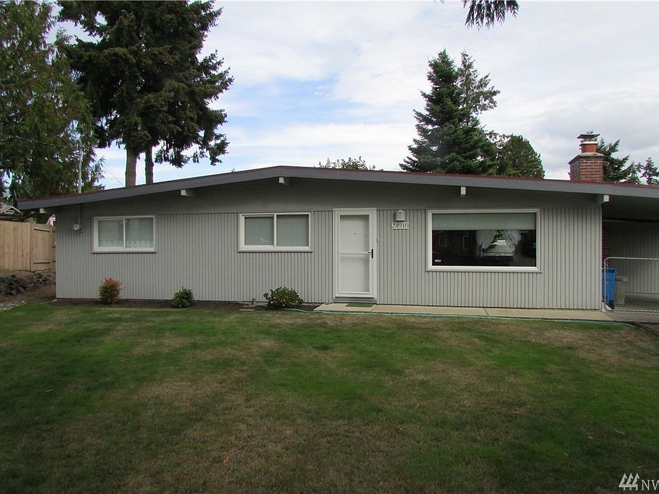 Fresh paint and well kept yard. Storm doors on front and side entry.