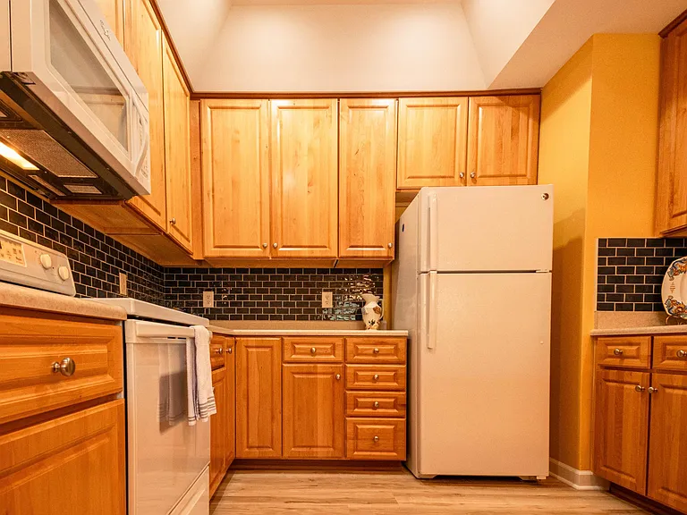 Kitchen with tile backsplash.