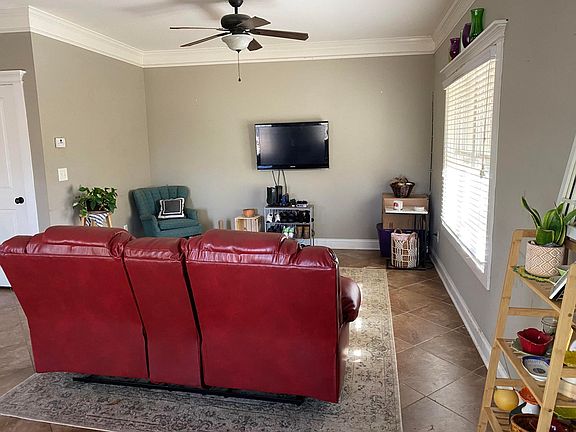 living room which is open to the kitchen and dining area