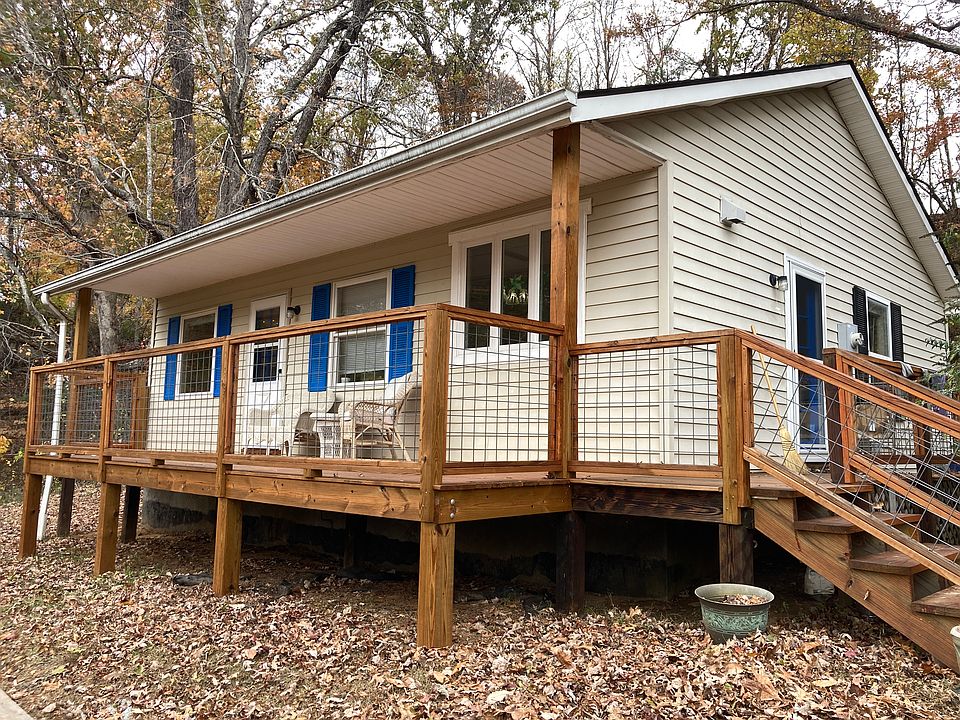 Deck in front with a treehouse feel.