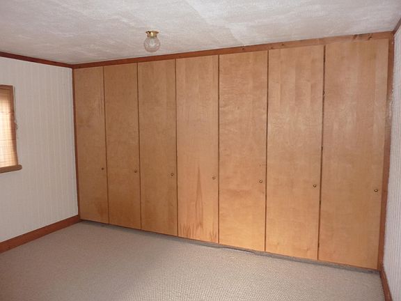 Bedroom and storage wall 