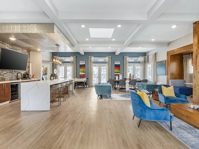 The clubhouse is air-conditioned, features plenty of comfortable seating, and warmly welcomes all residents for relaxation and social gatherings.