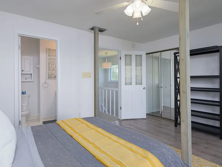 Two connecting closets with mirrored doors for ample storage