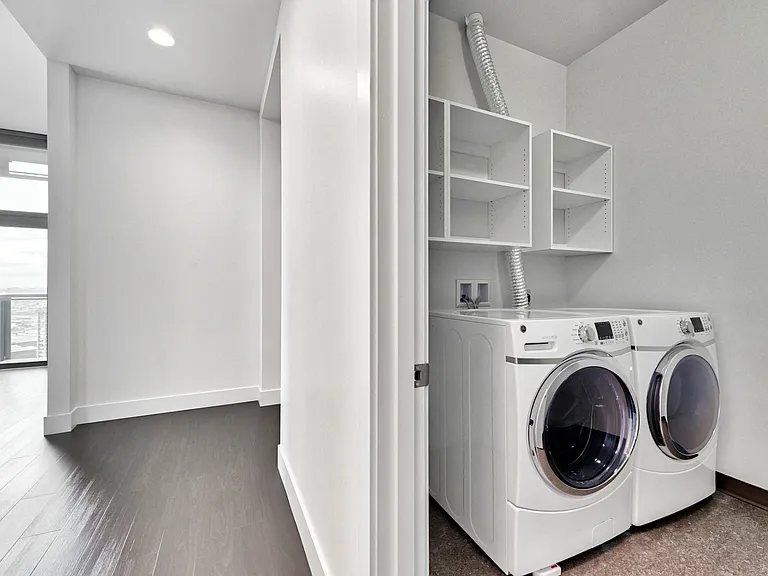 Laundry rooms with front loading side-by-side washer and dryers