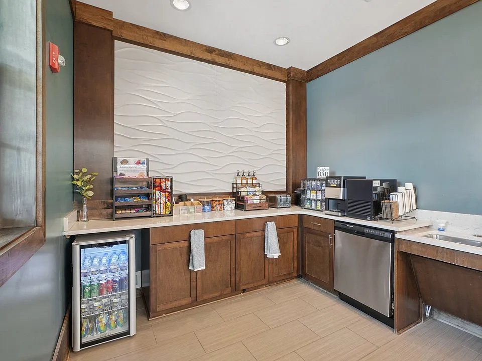 Modern resident coffee bar and refreshment area at Village at Broadstone Station in Apex, North Carolina