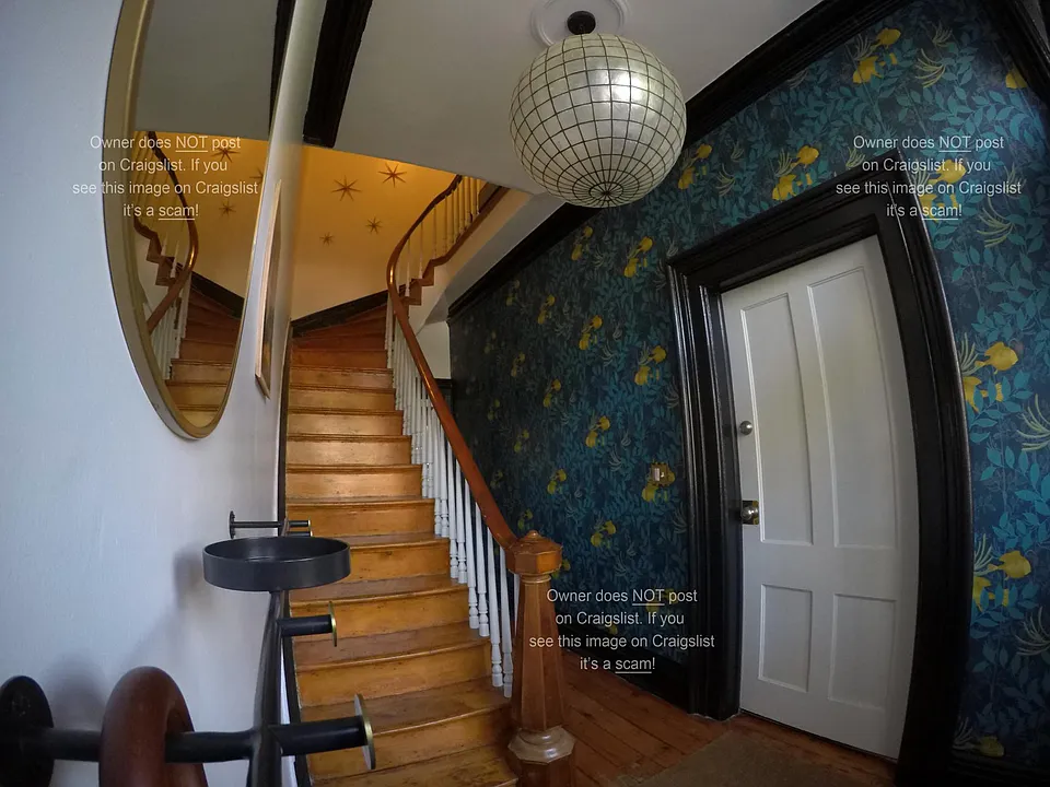 Front hall stairs to apartment
