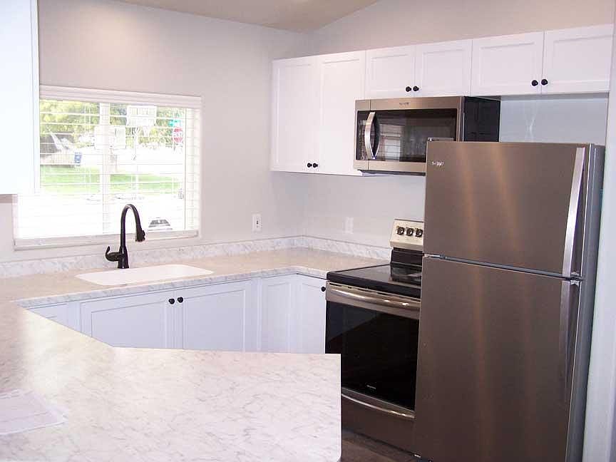 Everything in kitchen is brand new, cabinets, faucet, lighting, appliances, etc.