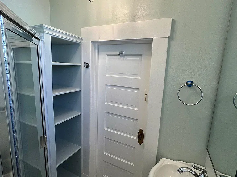 Bathroom with new chandelier and storage