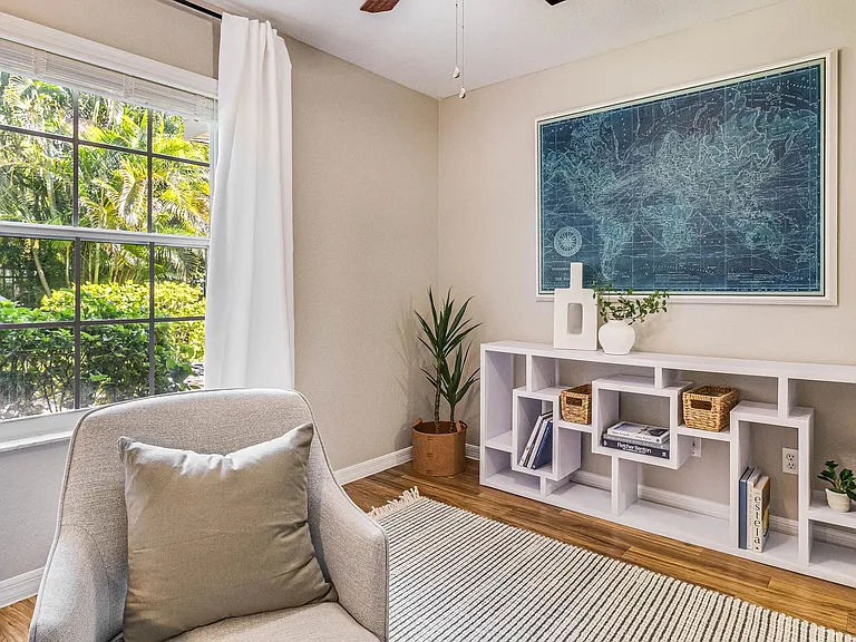 Spacious bedrooms boast well-organized closets, large windows, and ceiling fans.