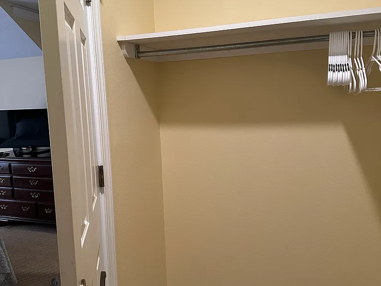 Closet includes hangars and slack/skirt hangers.