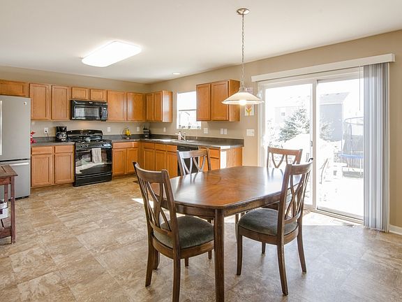 Large kitchen with eat-in breakfast room, Space for an island, Pantry and sliders out to paver patio & large fenced in backyard