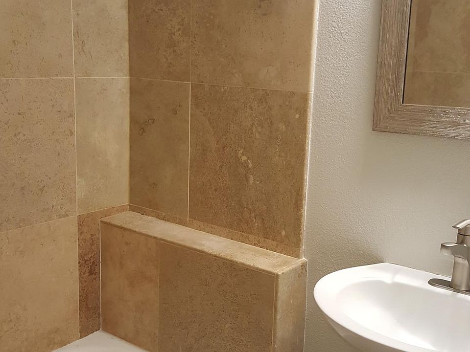 New faucet and mirror in master bathroom