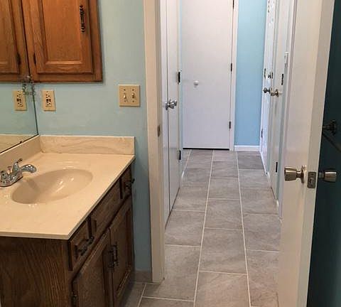 new tiles from bathroom to entryway