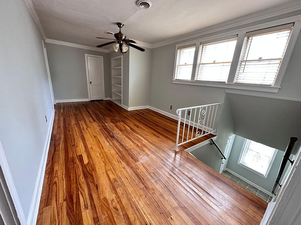 Front staircase leads to common area den