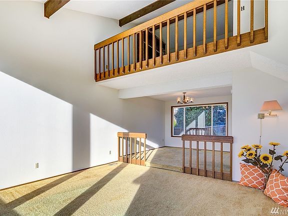 View of your living room, dining and loft from the foyer.
